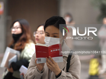 Candidates are waiting to enter the written exam of the Jiangsu 2024 civil servant exam in Nanjing, Jiangsu Province, China, on December 10,...