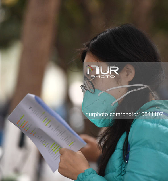 Candidates are waiting to enter the written exam of the Jiangsu 2024 civil servant exam in Nanjing, Jiangsu Province, China, on December 10,...