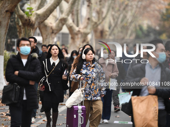 Candidates are waiting to enter the written exam of the Jiangsu 2024 civil servant exam in Nanjing, Jiangsu Province, China, on December 10,...