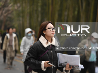 Candidates are waiting to enter the written exam of the Jiangsu 2024 civil servant exam in Nanjing, Jiangsu Province, China, on December 10,...