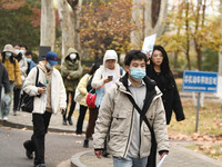 Candidates are waiting to enter the written exam of the Jiangsu 2024 civil servant exam in Nanjing, Jiangsu Province, China, on December 10,...