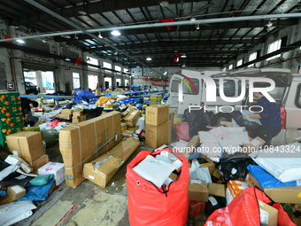 Workers are sorting items to be delivered at an express delivery company in Taicang, Jiangsu Province, China, on December 11, 2023. (