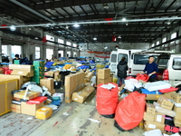 Workers are sorting items to be delivered at an express delivery company in Taicang, Jiangsu Province, China, on December 11, 2023. (