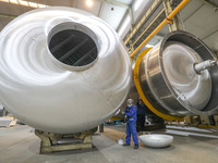 A worker is producing air separation equipment for export to Turkey in Huzhou, Zhejiang Province, China, on December 12, 2023. (