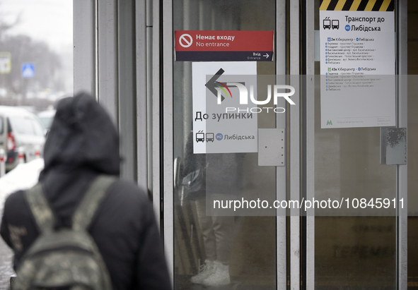 An arrow is pointing at a public transport stop for the Lybidska metro station, which is operating between the closed metro stations of the...