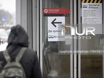 An arrow is pointing at a public transport stop for the Lybidska metro station, which is operating between the closed metro stations of the...