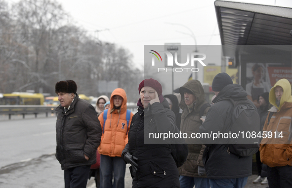 Passengers are waiting at a stop in Kyiv, Ukraine, on December 11, 2023, as additional buses and trolleybuses are operating between the clos...