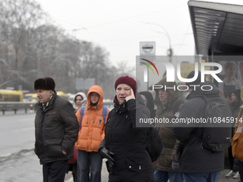 Passengers are waiting at a stop in Kyiv, Ukraine, on December 11, 2023, as additional buses and trolleybuses are operating between the clos...