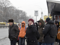 Passengers are waiting at a stop in Kyiv, Ukraine, on December 11, 2023, as additional buses and trolleybuses are operating between the clos...