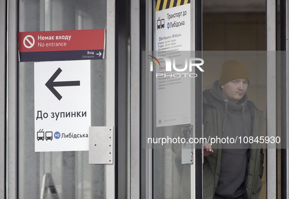 In Kyiv, Ukraine, on December 11, 2023, a man is leaving the Teremky metro station on the Blue Line, which is closed due to repairs. Train t...