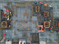 Workers are stepping up construction at the resettlement area project site in Yuexi County, Anqing City, Anhui Province, China, on December...