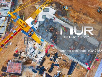 Workers are stepping up construction at the resettlement area project site in Yuexi County, Anqing City, Anhui Province, China, on December...