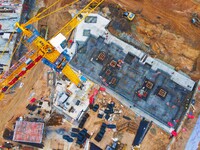 Workers are stepping up construction at the resettlement area project site in Yuexi County, Anqing City, Anhui Province, China, on December...