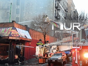 A fire is occurring at Broadway and 231st in the Bronx, New York, on December 13, 2023. No one is hurt, but it is destroying a few businesse...