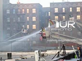 A fire is occurring at Broadway and 231st in the Bronx, New York, on December 13, 2023. No one is hurt, but it is destroying a few businesse...