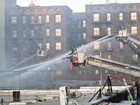 A fire is occurring at Broadway and 231st in the Bronx, New York, on December 13, 2023. No one is hurt, but it is destroying a few businesse...