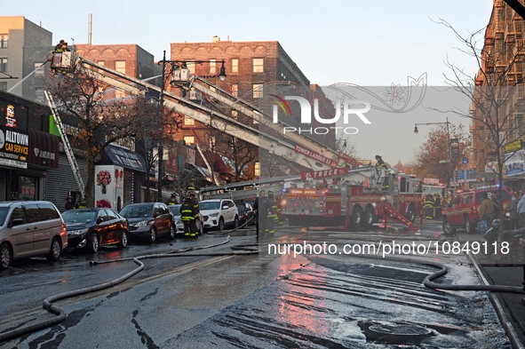 A fire is occurring at Broadway and 231st in the Bronx, New York, on December 13, 2023. No one is hurt, but it is destroying a few businesse...