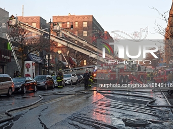 A fire is occurring at Broadway and 231st in the Bronx, New York, on December 13, 2023. No one is hurt, but it is destroying a few businesse...