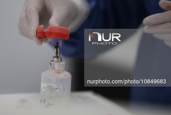 A dentist is performing tests with dental prostheses at the Centro de Odontogeriatria TIII Doctor Guillermo Roman y Carrillo Health Centre i...