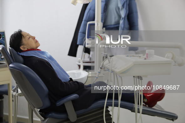 An older adult is sitting inside the Centro de Odontogeriatria TIII Doctor Guillermo Roman y Carrillo Dental Clinic in Iztapalapa, Mexico Ci...