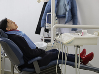 An older adult is sitting inside the Centro de Odontogeriatria TIII Doctor Guillermo Roman y Carrillo Dental Clinic in Iztapalapa, Mexico Ci...