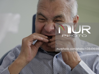 An older adult is being fitted with a dental prosthesis at the Centro de Odontogeriatria Centro de Salud TIII Doctor Guillermo Roman y Carri...