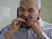 An older adult is being fitted with a dental prosthesis at the Centro de Odontogeriatria Centro de Salud TIII Doctor Guillermo Roman y Carri...