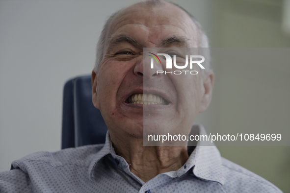 An older adult is smiling after having a dental prosthesis fitted at the Centro de Salud TIII Doctor Guillermo Roman y Carrillo Dental Clini...