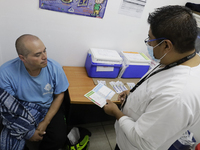 Medical personnel at the Geriatric Dentistry Clinic in the Iztapalapa mayor's office, Mexico City, are receiving patients for the applicatio...