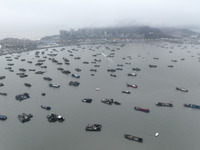 Fishing boats are moored at the central fishing port of Liandao to avoid wind and waves in Lianyungang, Jiangsu Province, China, on December...