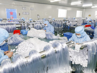 Workers are making medical infusion sets for export at a workshop in Huai'an City, Jiangsu Province, China, on December 14, 2023. (