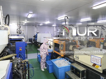 Workers are making medical infusion sets for export at a workshop in Huai'an City, Jiangsu Province, China, on December 14, 2023. (