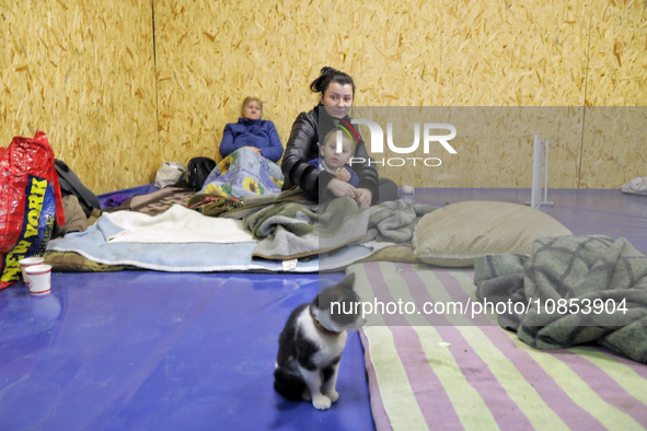 Members of the public are staying in a temporary shelter for the victims of a Russian overnight attack in Odesa, southern Ukraine, on Decemb...