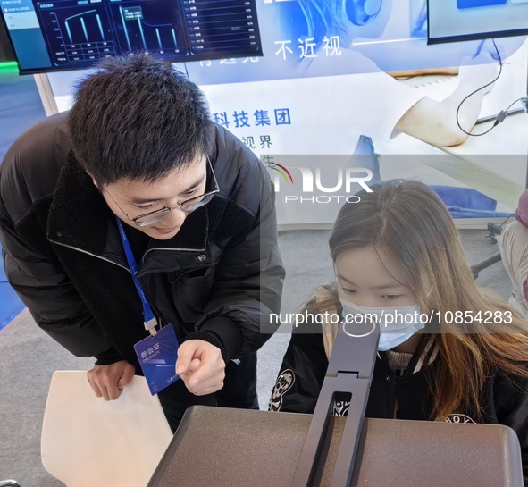 Visitors are attending the first Jiangsu (Suzhou) Educational Equipment Exhibition in Suzhou, Jiangsu Province, China, on December 15, 2023....