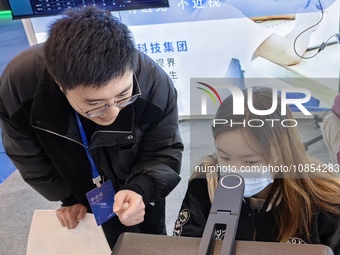 Visitors are attending the first Jiangsu (Suzhou) Educational Equipment Exhibition in Suzhou, Jiangsu Province, China, on December 15, 2023....