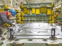 A worker is working at the production workshop of Great Wall Motor's Taizhou Smart Factory in Taizhou, Jiangsu Province, China, on December...