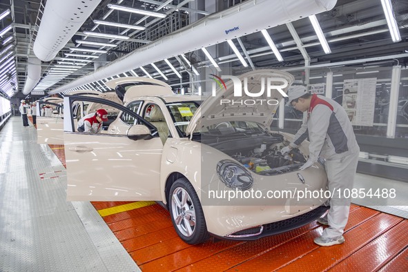 A worker is working at the production workshop of Great Wall Motor's Taizhou Smart Factory in Taizhou, Jiangsu Province, China, on December...