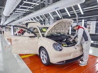 A worker is working at the production workshop of Great Wall Motor's Taizhou Smart Factory in Taizhou, Jiangsu Province, China, on December...