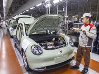 A worker is working at the production workshop of Great Wall Motor's Taizhou Smart Factory in Taizhou, Jiangsu Province, China, on December...