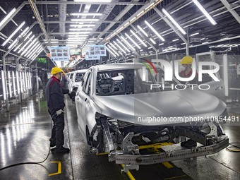 A worker is working at the production workshop of Great Wall Motor's Taizhou Smart Factory in Taizhou, Jiangsu Province, China, on December...