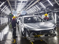 A worker is working at the production workshop of Great Wall Motor's Taizhou Smart Factory in Taizhou, Jiangsu Province, China, on December...