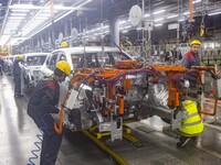 A worker is working at the production workshop of Great Wall Motor's Taizhou Smart Factory in Taizhou, Jiangsu Province, China, on December...