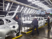 A worker is working at the production workshop of Great Wall Motor's Taizhou Smart Factory in Taizhou, Jiangsu Province, China, on December...