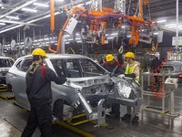 A worker is working at the production workshop of Great Wall Motor's Taizhou Smart Factory in Taizhou, Jiangsu Province, China, on December...