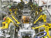 A robot is performing welding operations at the production workshop of Great Wall Motor's Taizhou Smart Factory in Taizhou, Jiangsu province...