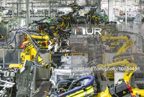 A robot is performing welding operations at the production workshop of Great Wall Motor's Taizhou Smart Factory in Taizhou, Jiangsu province...