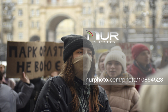 Demonstrators are holding placards as they demand an increase in financial support for the Armed Forces of Ukraine outside the Kyiv City Sta...