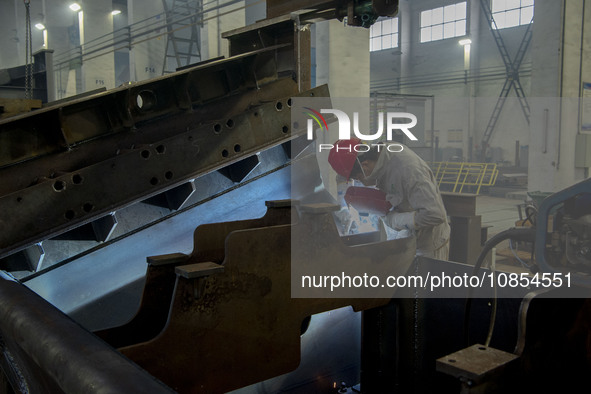 A worker is working at a workshop of a manufacturing enterprise in Hai'an, Jiangsu Province, China, on December 14, 2023. 