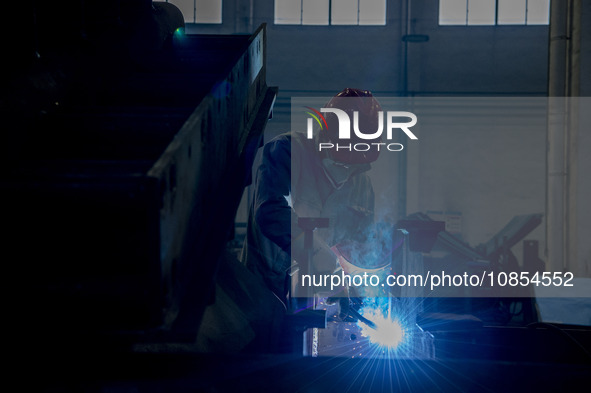 A worker is working at a workshop of a manufacturing enterprise in Hai'an, Jiangsu Province, China, on December 14, 2023. 