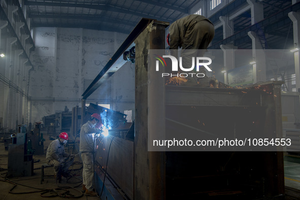 A worker is working at a workshop of a manufacturing enterprise in Hai'an, Jiangsu Province, China, on December 14, 2023. 